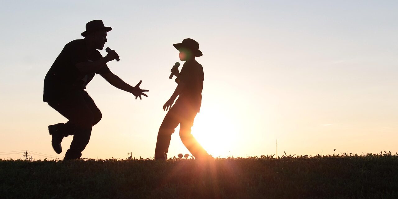 Photo by DawnyellReese father and son, singing, nature, sunset, outdoors, dancing, sing, father's day
